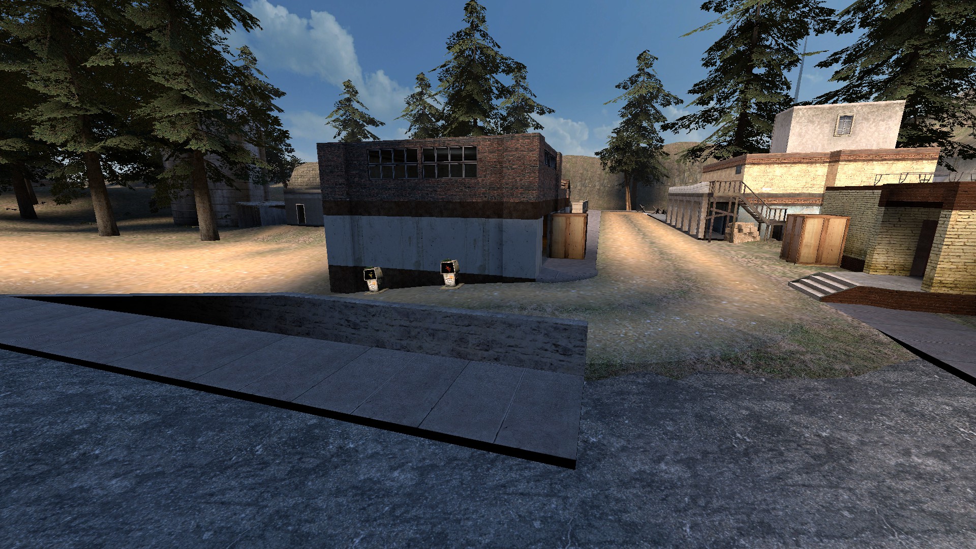 On the side of the garage, near the corner bend